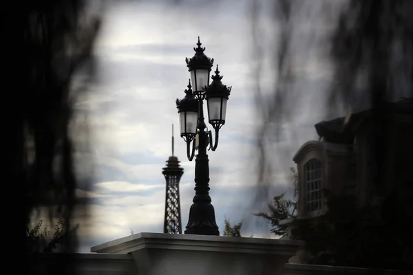Vintage street lantern on the background of the tower