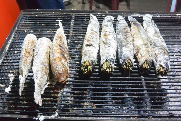 Char grilled lake fish in salt