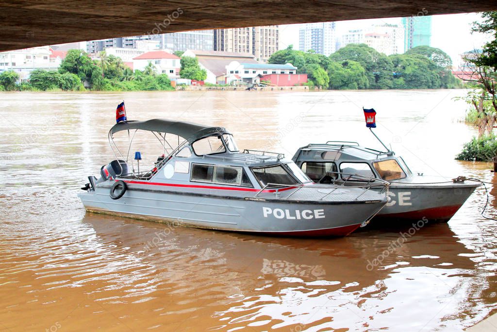 Two gray police boats in the River
