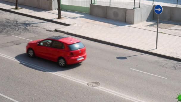 Red Car Chased Green Viruses Big Legged Spheres Flying Road — Stock Video