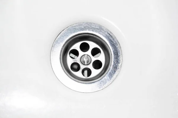 Drain for water in the sink, bathtub on a white background