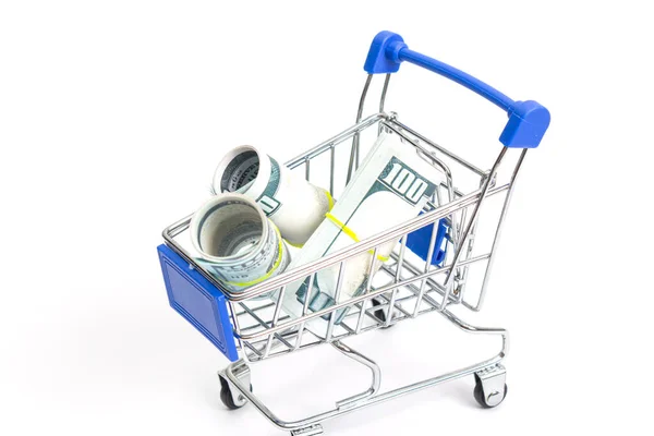 steel shopping trolley with hundred dollar rolls with blue inserts on a white background isolate