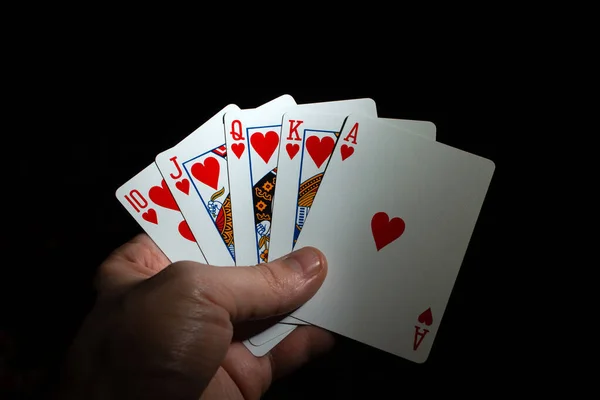 Mão Segurar Corações Royal Flush Poker Fundo Espaço Cópia Preta — Fotografia de Stock