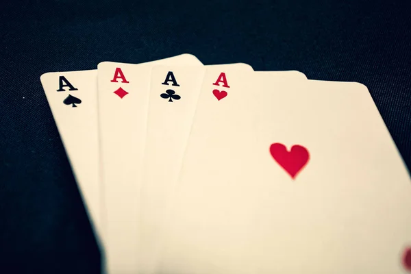 Four aces playing cards on black background — Stock Photo, Image