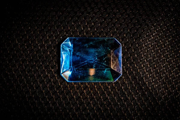blue sapphire gem stone on black background