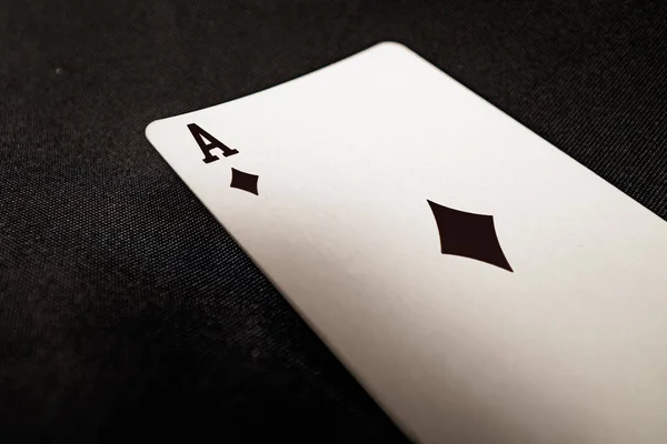 Black Ace of Diamonds on black background — Stok fotoğraf