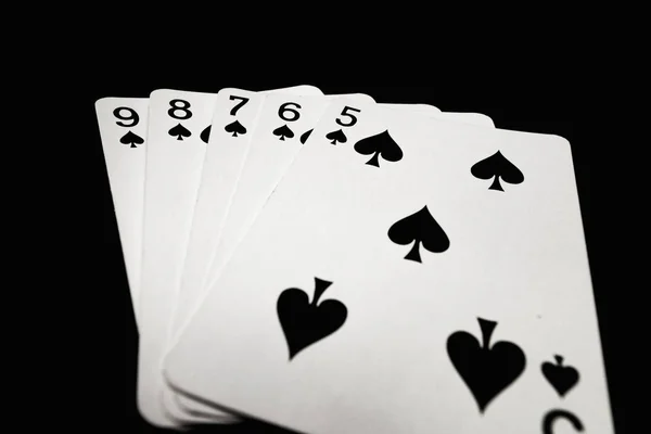 Straight flush de espadas sobre fundo preto — Fotografia de Stock