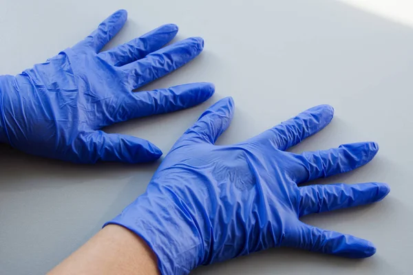 Two hand in blue latex glove, personal protective equipment medical accessory to ensure the safety of staff and patient. To protect the skin in contact with toxic substances, compliance with sterility — Stock Photo, Image