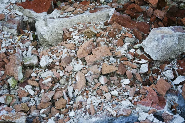 a pile of broken bricks, debris, destroyed building
