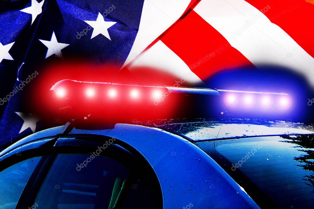 Road police patrol car with lightbar alarm emergency on the street of city at night. Flashing blue and red police car led lights in night darkness on American flag with copyspace for text. Background 