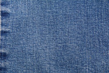 Arka planda Denim kumaşı. Klasik mavi desenli kot. Üst görünüm, metin için Kopyalama Boşluğu.