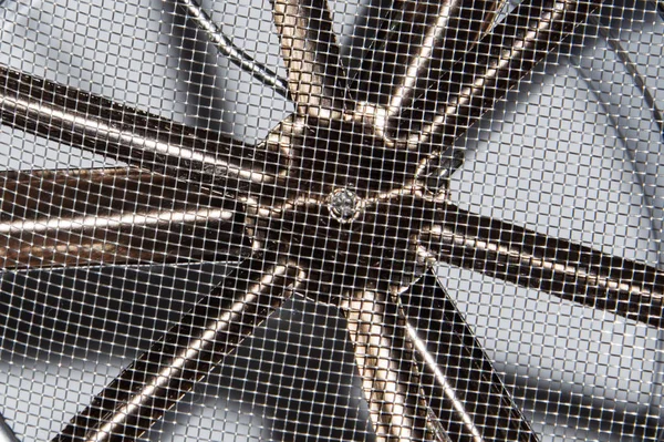 Closeup view of Industrial fan turbine a metal grate. Air conditioning ventilation fan with a round mesh grill cover — 스톡 사진