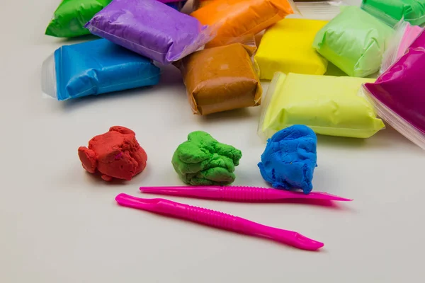 Airy plasticine mass for modeling colored super light plasticine on a white background