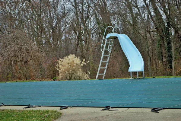 Backyard Swimming Pool Diving Board Pool Slide Tarped Closed Winter — ストック写真