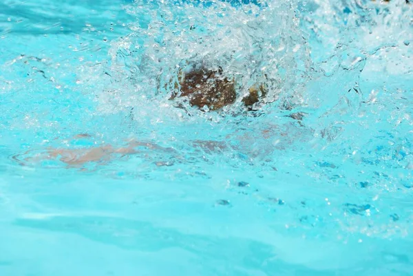 splash after someone jumped into a swimming pool