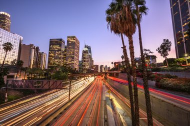 Downtown Los Angeles at night with light trails clipart