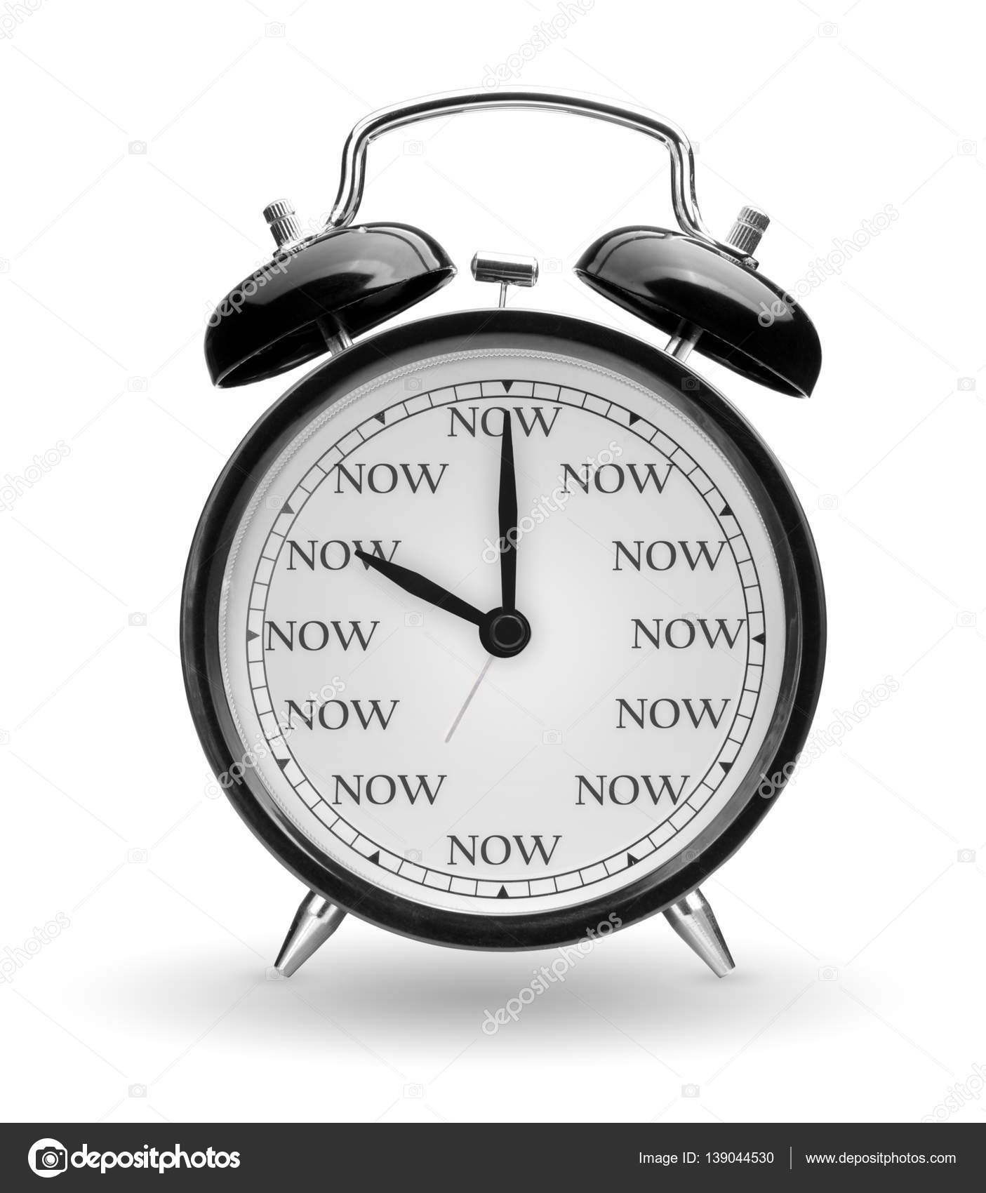 Time is now concept. Classic alarm clock isolated on white backg Stock