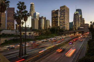 Traffic in downtown Los Angeles, California at sunset clipart