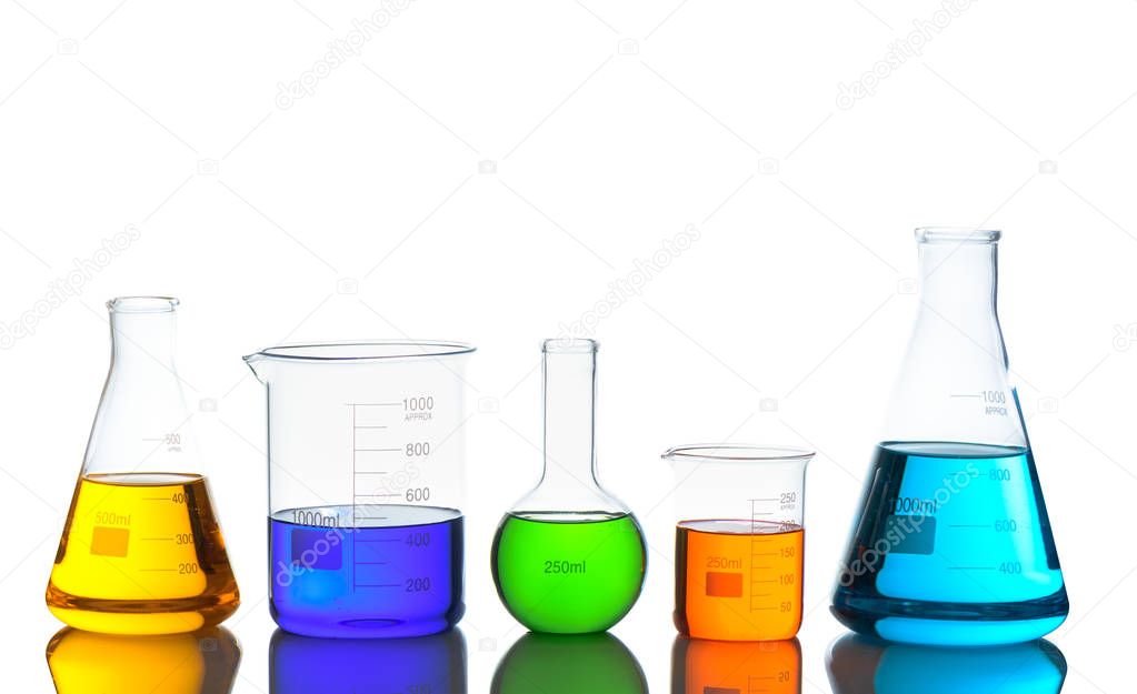 Laboratory glassware set with color liquid and reflection.