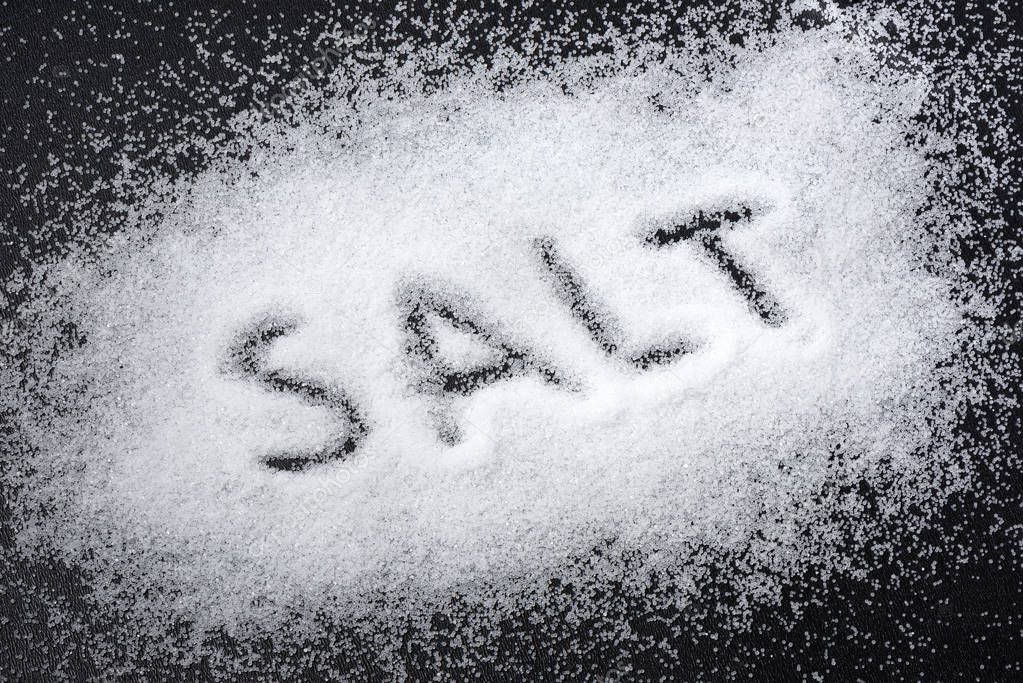The word salt written into a pile of salt 