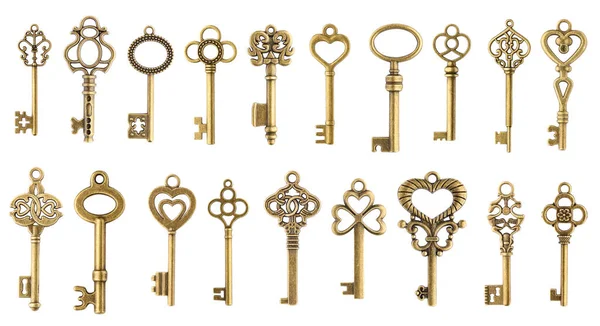 Set of vintage golden skeleton keys isolated on white background