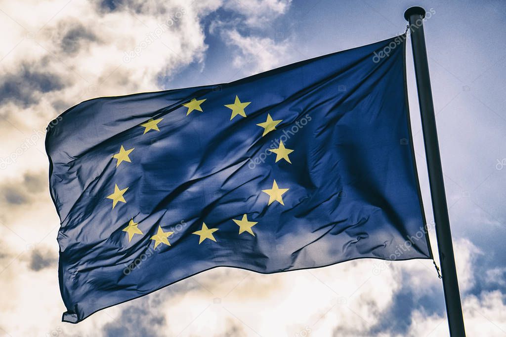  European Union flag against a blue sky. 