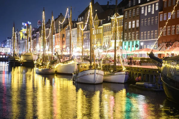 stock image Evening view to boats in front of colourful old houses at Nyhavn harbour canal in Copenhagen, Denmark. 