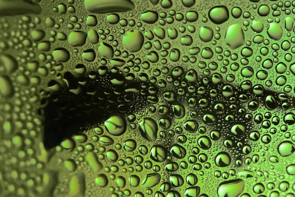 Gotas de água em vidro. Fundo abstrato bonito verde. Macro — Fotografia de Stock