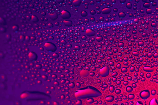 Water drops on glass. Purple beautiful abstract background. Macro — Stock Photo, Image