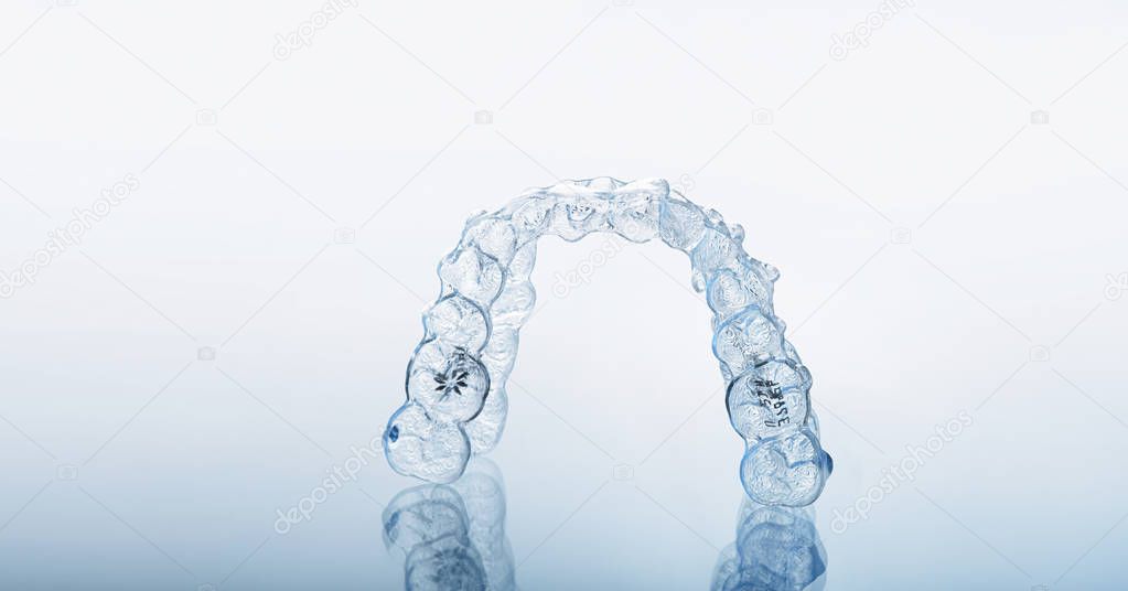 Invisible orthodontics cosmetic brackets, tooth aligners.