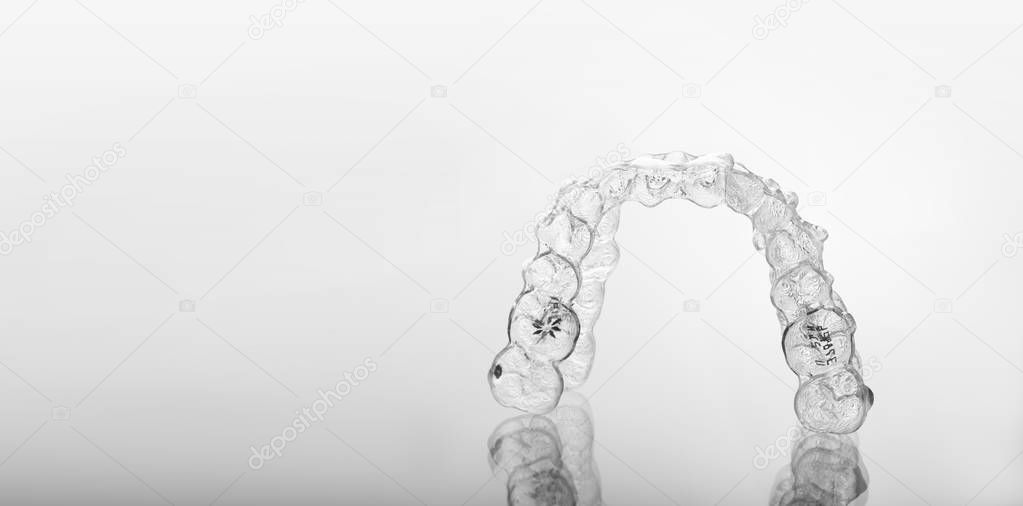 Invisible orthodontics cosmetic brackets, tooth aligners.
