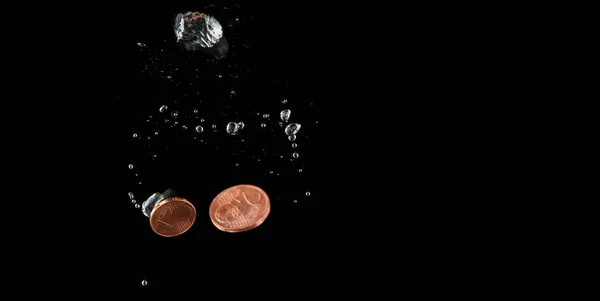 Sinking Euro. Splash of coins falling into the water. — Stock Photo, Image