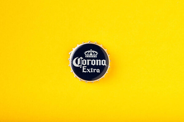 Cap of Corona Extra beer close up. Corona Extra Beer On yellow background. Corona is made in Mexico and is the top selling imported beer in the United States. 13.03.2020, Russia.