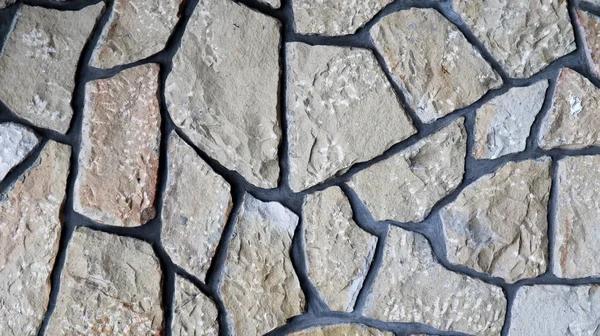 La textura de la pared de piedra. Antiguo castillo de piedra textura de la pared de fondo. Pared de piedra como fondo o textura. Parte de un muro de piedra, para fondo o textura. patrón color gris diseño de estilo moderno —  Fotos de Stock