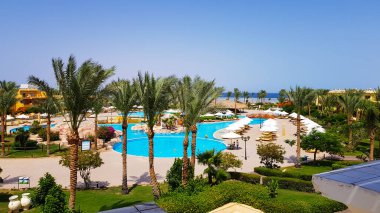 Sharm El Sheikh, Egypt - July 13, 2019: main pool and Amway territory. Luxurious hotel grounds. Landscaping and pool with sun loungers overlooking the sea. Hotel and spa in Sharm El Sheikh in Egypt