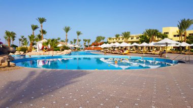 Sharm El Sheikh, Egypt - July 13, 2019: main pool and Amway territory. Luxurious hotel grounds. Landscaping and pool with sun loungers overlooking the sea. Hotel and spa in Sharm El Sheikh in Egypt