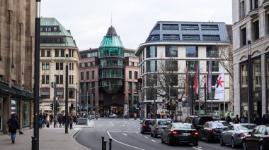Dusseldorf, Germany - February 20, 2020: city and shopping streets around Dusseldorf. Street scenes and parked cars on the street. Modern commercial architecture and residential buildings in Germany