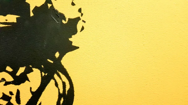 Black abstract paint splashes dripping on a bright yellow background. Black paint splashes on a yellow background. concept of art ideas. Paint brush texture yellow and black on background.