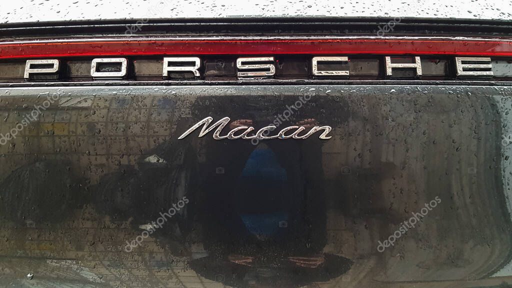 Ukraine, Kiev - March 27, 2020: Porsche Macan sports black car detailed rear view of the body with a logo