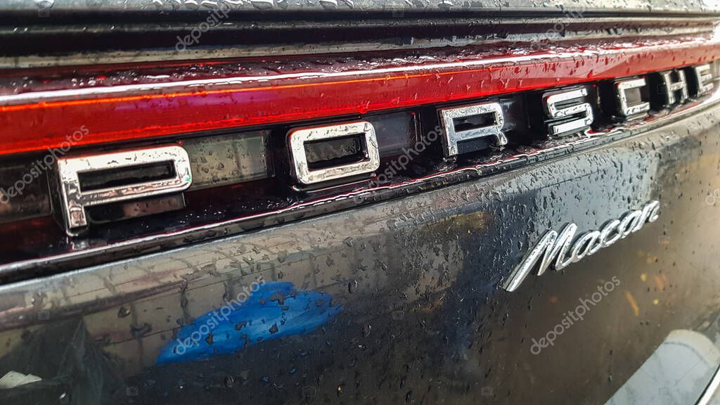 Ukraine, Kiev - March 27, 2020: Porsche Macan sports black car detailed rear view of the body with a logo