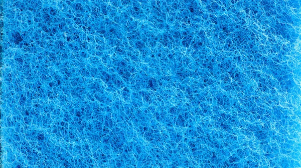 以蓝色多孔结构形式出现的背景 大海绵状 关闭蓝色海绵表面为纹理背景 复制空间 — 图库照片