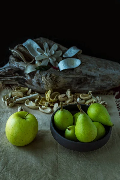 Natural and fresh seasonal fruits on the table on a wooden table width natural decoration
