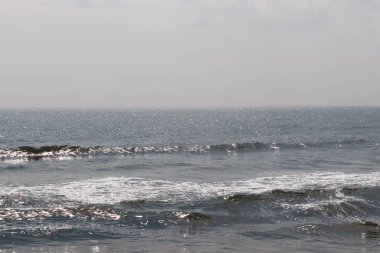 Tropikal plaj ile bokeh güneş ışık dalga arka plan bulanıklık.