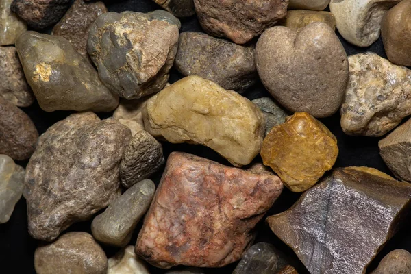 background of small river stones.multicolored stones close-up