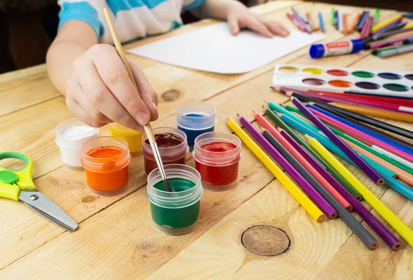 Child Draws Lot Pencils Paints Drawing Wooden Background — Stock Photo, Image