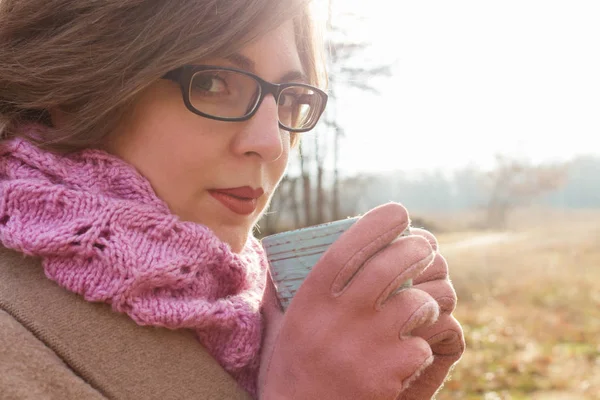 Woman drinking outdoor — Stock Photo, Image