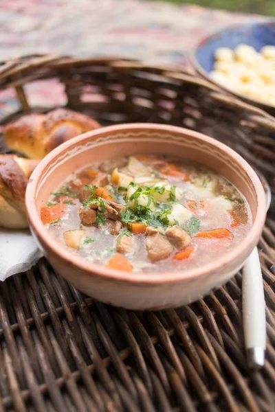 Traditional food, goulash soup with fresh scone — Stock Photo, Image