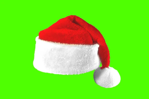 Santa Hat na zielonym tle — Zdjęcie stockowe