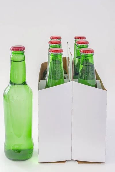 A six pack of a green beer bottles isolated on white background — Stock Photo, Image