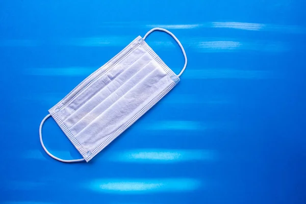 Surgical Masks, Face Mask Disposable Dust Proof Face Mask on a blue background
